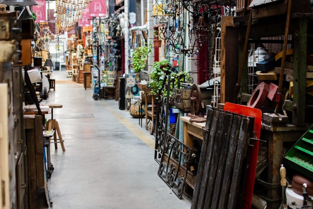 Antique market in Delhi showcasing various furniture items and decor