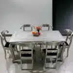 Artisan Metal Dining Table Set with chairs in a dining room