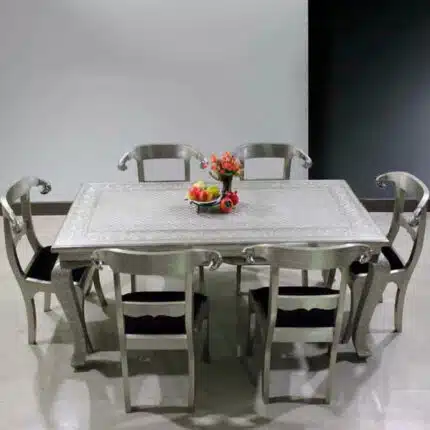 Artisan Metal Dining Table Set with chairs in a dining room