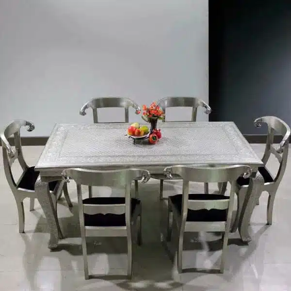 Artisan Metal Dining Table Set with chairs in a dining room